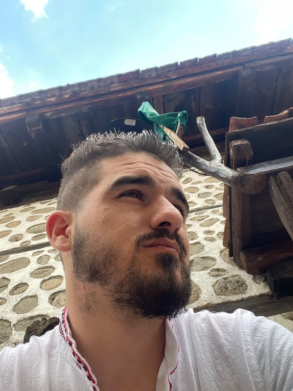 Selfies in traditional dress at a stone building, with casual text graphics