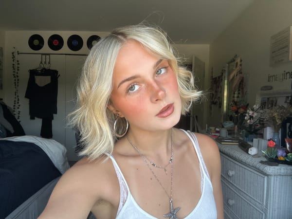 Back-to-back selfies in Whistler, silver jewelry and white tank top