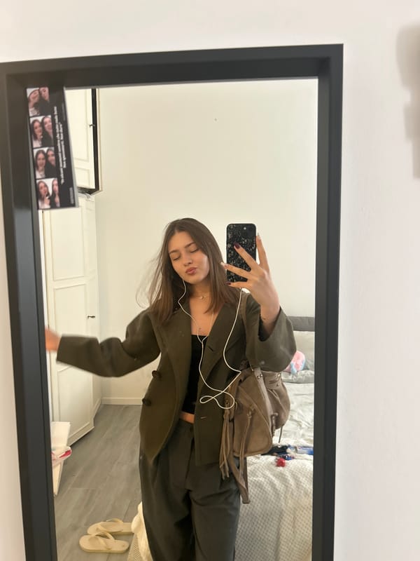 Woman takes mirror selfies in Milan apartment Thursday morning