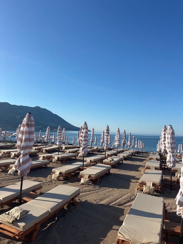 Bečići beach before the crowds, chairs ready for the day
