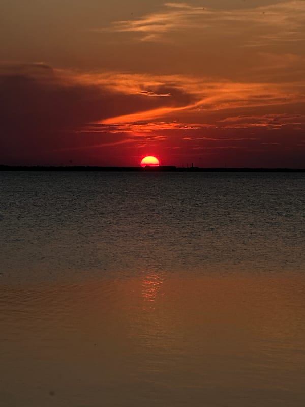 Evening scenes documented across Kokshetau including sunset sailing, urban walkways