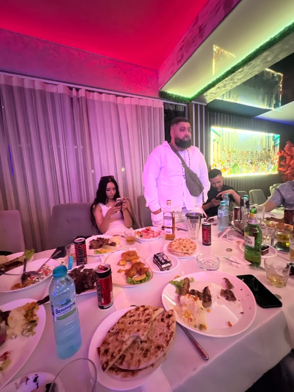 Social gathering at illuminated restaurant in Sevlievo, Bulgaria