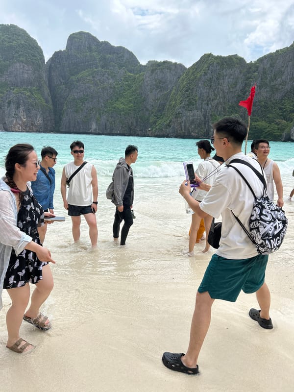 Beach guide directs tourists at Ao Nang Thailand