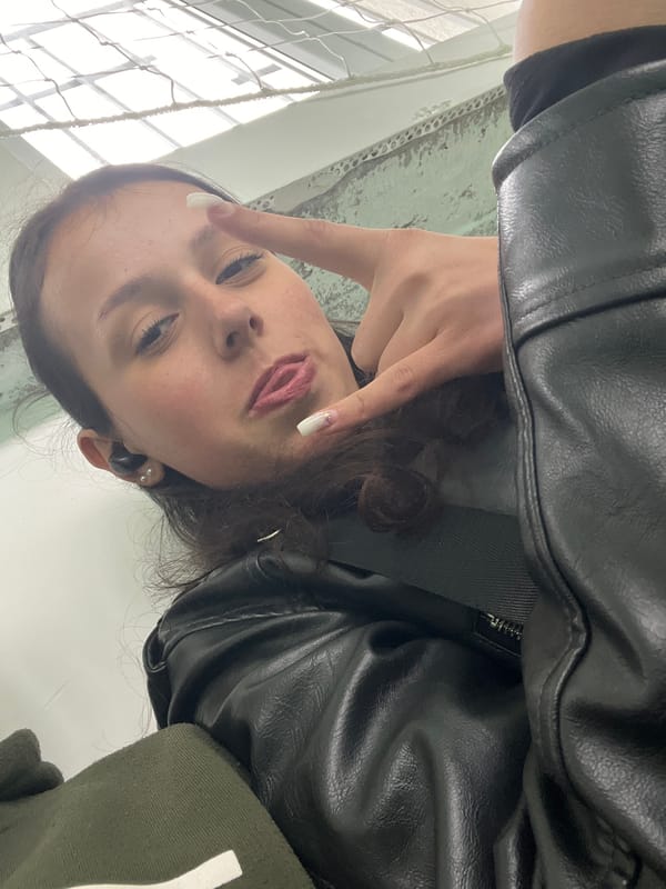 Woman takes indoor selfies in Karnobat, Bulgaria