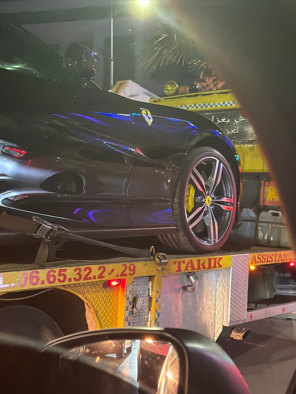 Ferrari towed by assistance truck in Meknes, Morocco