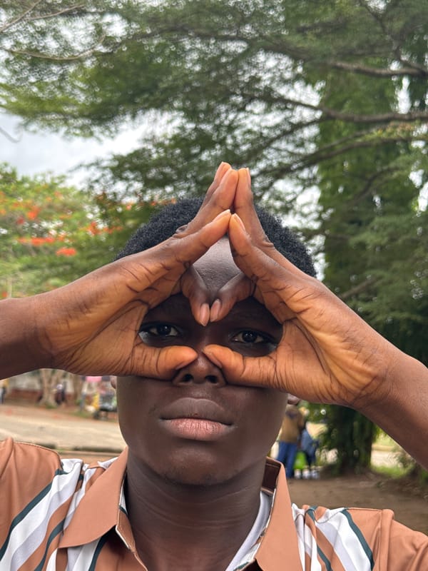 Young men photograph casual moments around Nigerian university campus