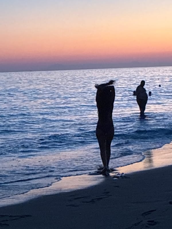 Sunset on an Alanya beach, silhouette in the surf