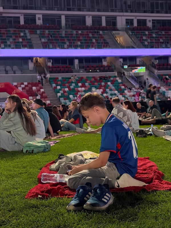 Crowd gathers at Dinamo Stadium for live football broadcast