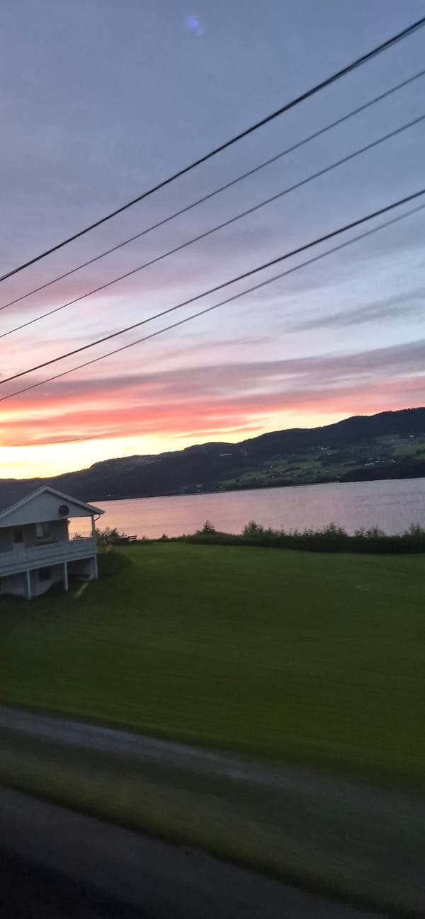 Vivid sunset paints the sky over Biri, Norway