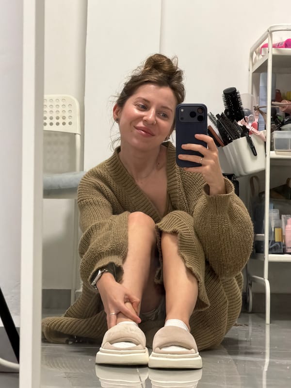 Woman takes mirror selfie in Bat Yam apartment
