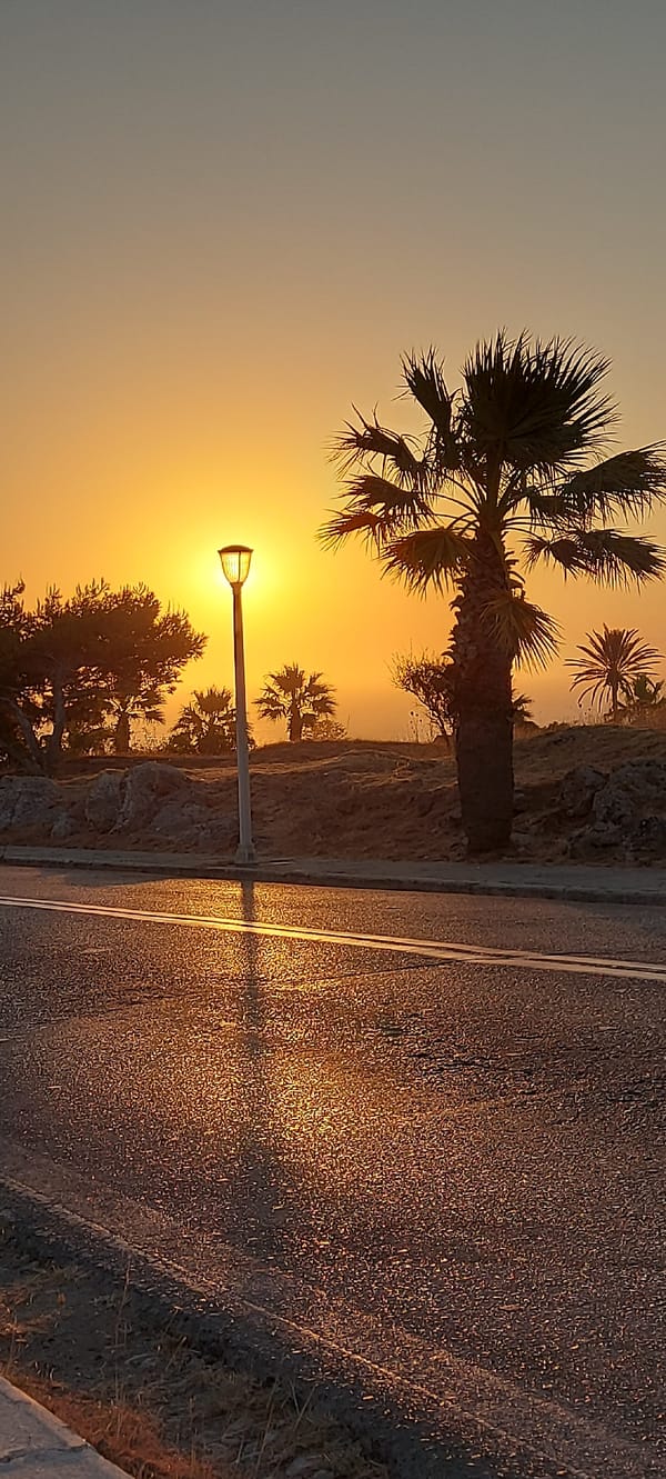 Streetlamp silhouette at sunset, Rhodes roadside