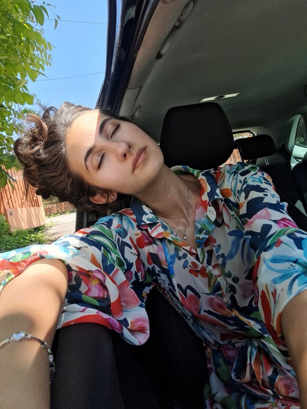 Woman photographed in car during brief morning moment in Sofia