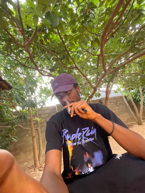 Person smoking outdoors in Jos, Nigeria morning hours