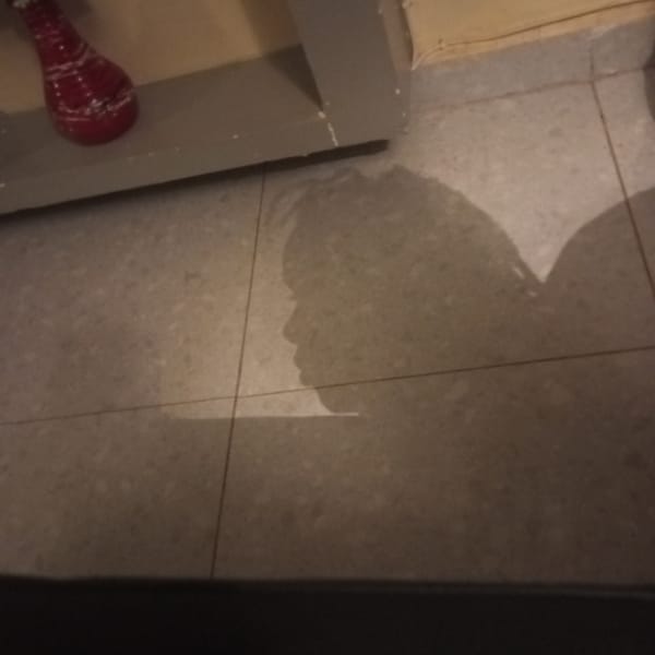 Indoor scene with tiled floor and furniture documented in Kenya