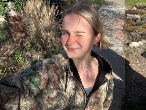 Woman photographed on sunny Vancouver residential street with blooming tree