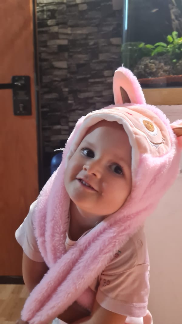 Child in pink bunny outfit photographed in Israel