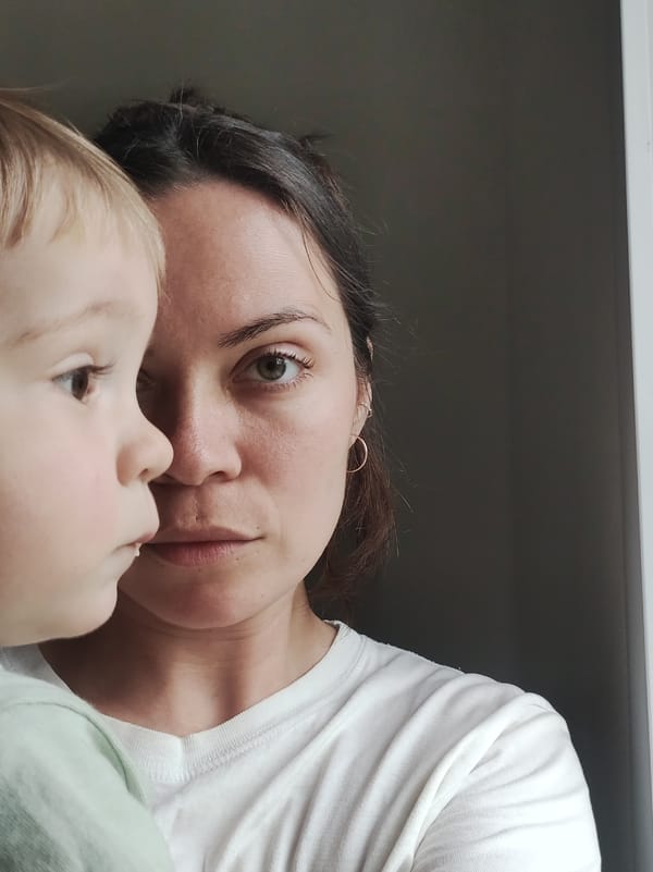 Woman and child share close moment in early morning