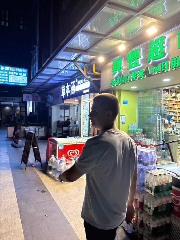 Haizhu District streets lit up at night near Grand Plaza