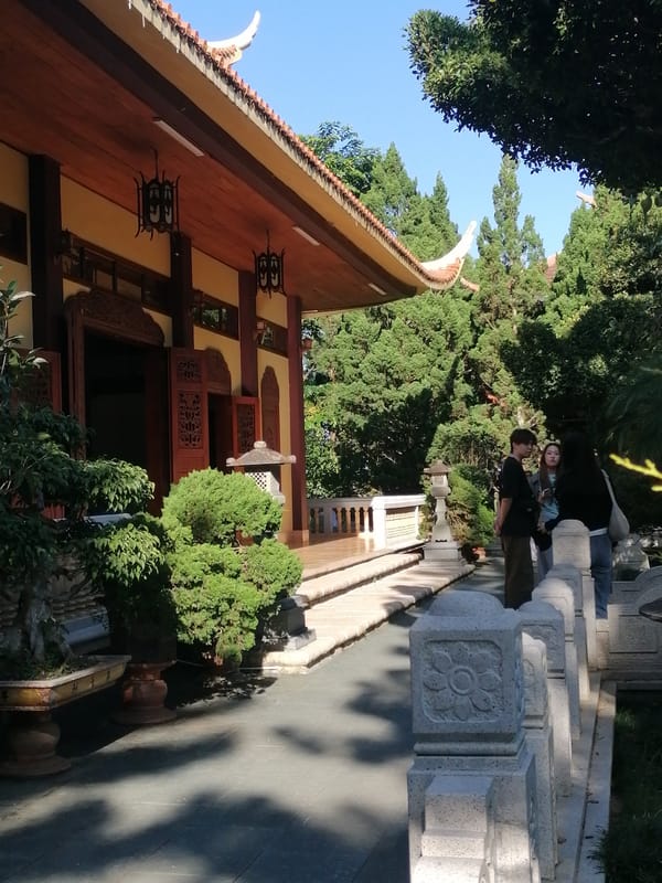 Buddhist temple grounds in Da Lat, with gardens and wildlife