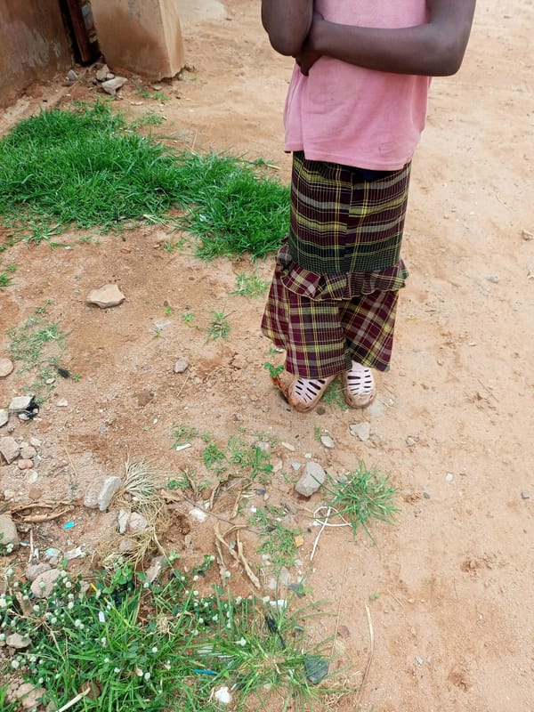 Standing on dry, rocky ground in Gombe, Nigeria