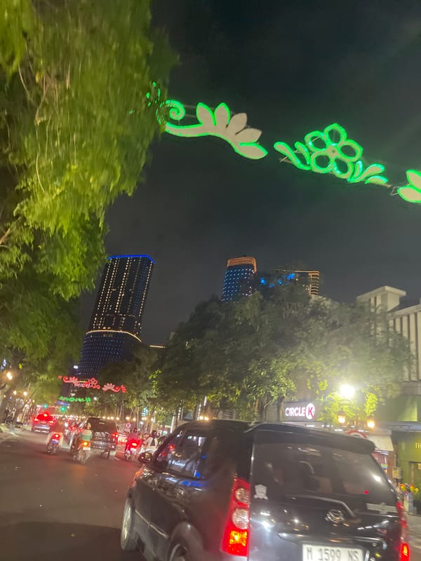 Surabaya's illuminated downtown towers at night