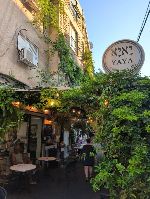 YAYA café terrace with vine-covered facade in Ramat Gan