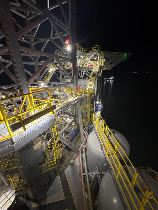 Industrial facility illuminated at night in Italy