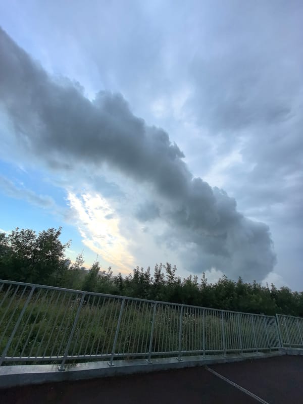 Storm clouds and smoke plume over Perm skyline