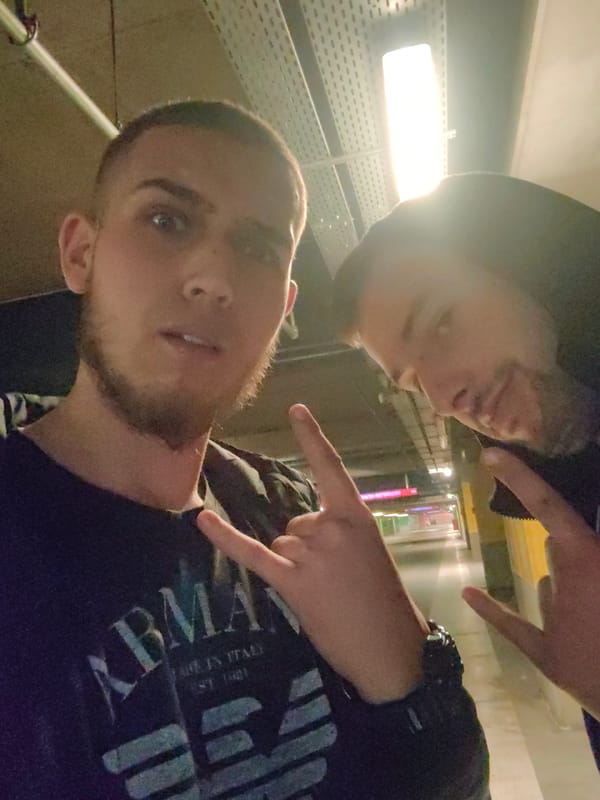 Two men photographed in Sofia parking garage