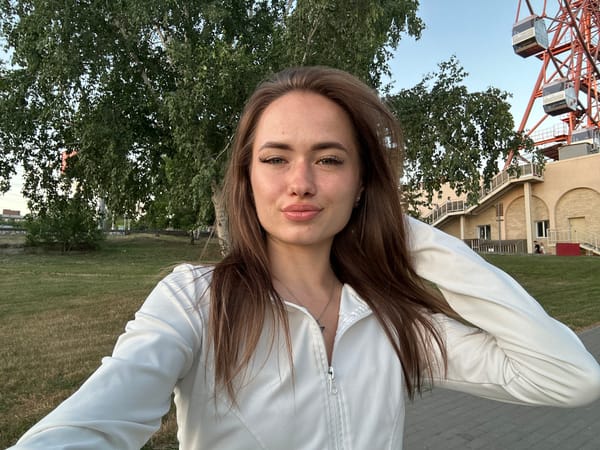 Selfies and scenic shots at a riverside park with Ferris wheel