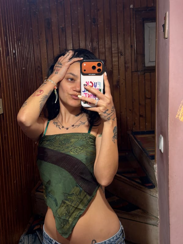 Woman takes mirror selfies in wood-paneled indoor setting
