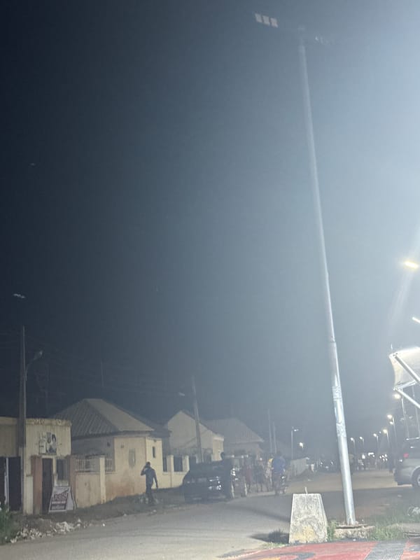 A quiet Abuja evening with a dog, selfies, and street scenes