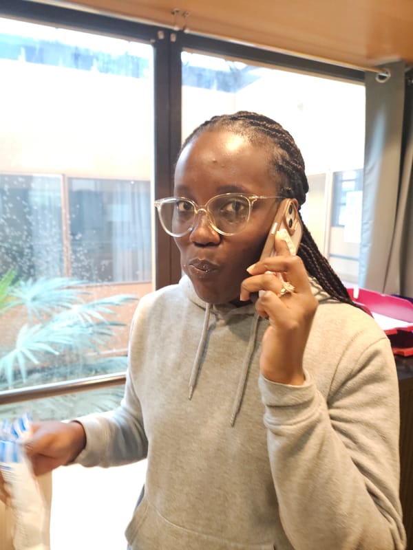 Woman makes phone call in Paris morning