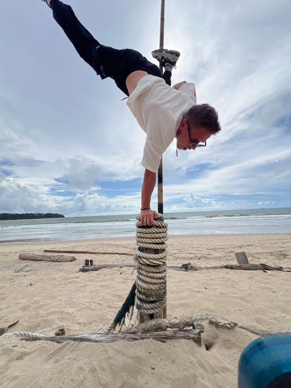 Beach crew works a bamboo pole setup in Choeng Thale