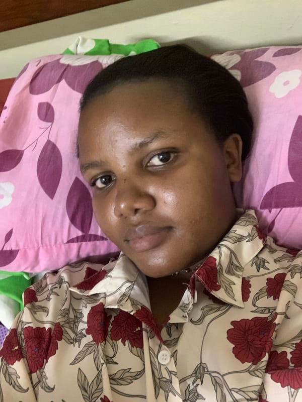 Woman resting in pajamas captured in Dar es Salaam