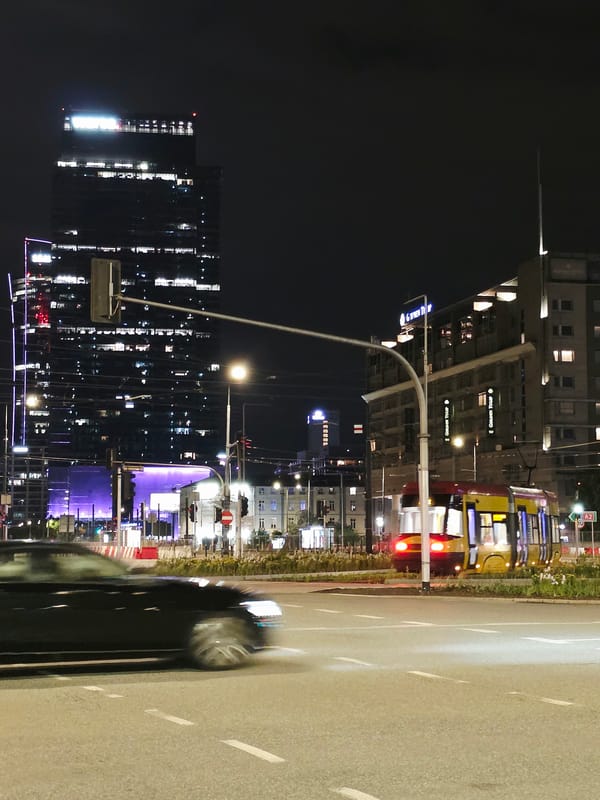 Warsaw city center on a summer night, streets and skyline