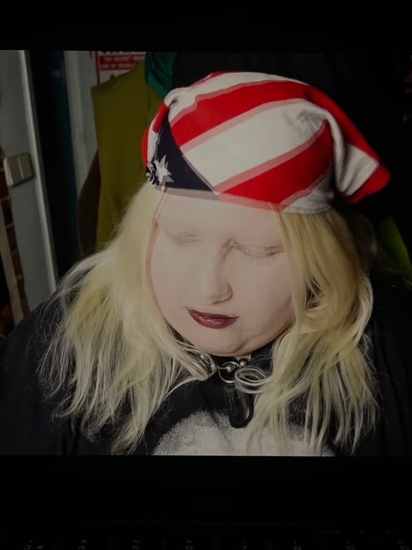 Portrait of blonde person displayed on laptop in Torrent