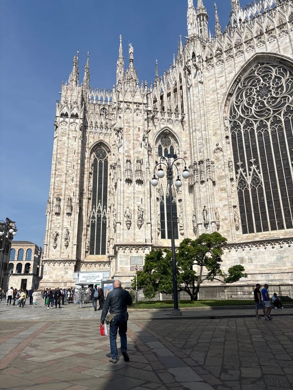 Tourist documents Milan Cathedral architecture from multiple angles