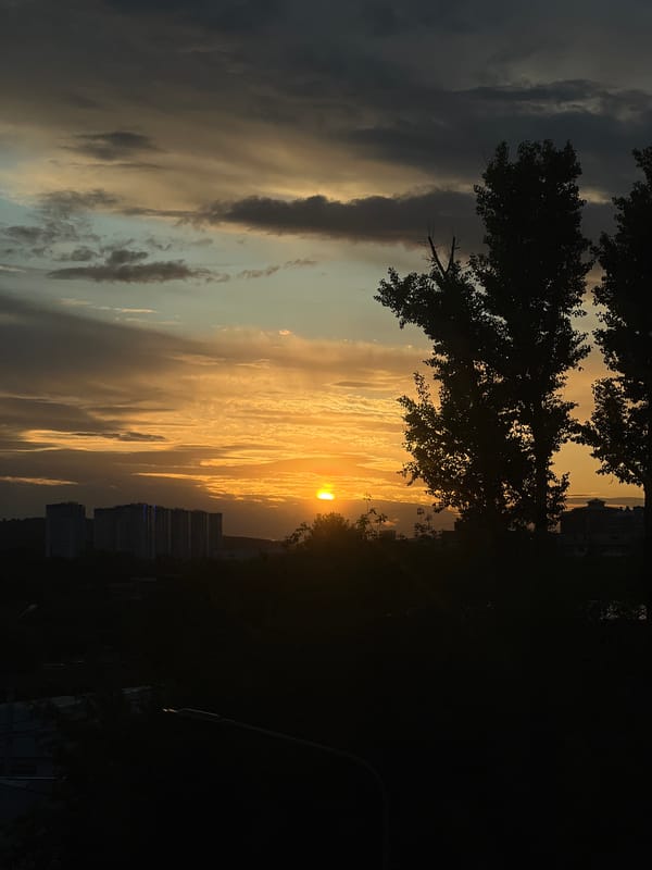 Dramatic sunset illuminates Irkutsk skyline with vibrant colors