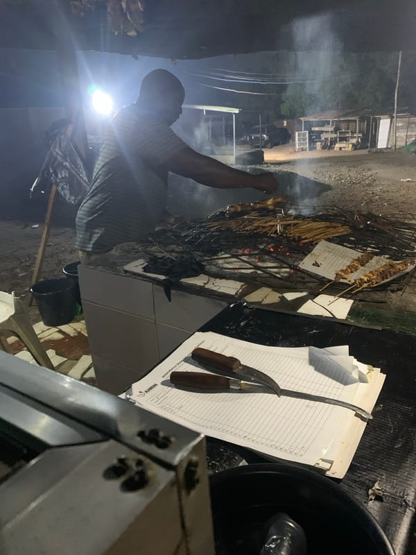 Evening street grilling scene captured in Adankolo, Nigeria