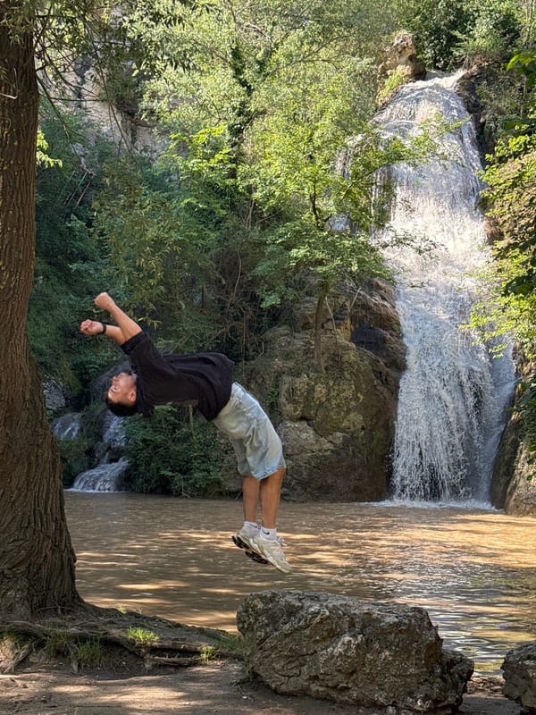 Man performs backflip stunt at Hotnitsa Waterfall, Bulgaria