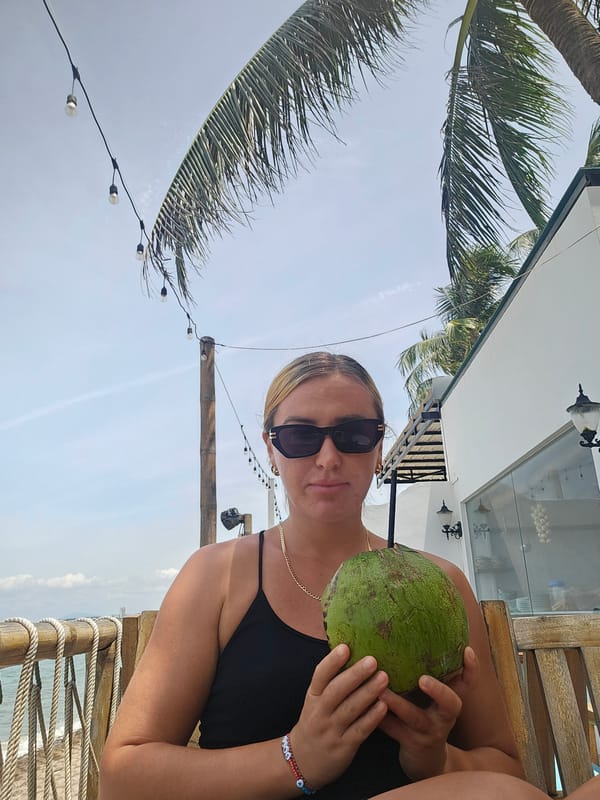 Coconut drink break at an outdoor spot in Phu Thuy Ward