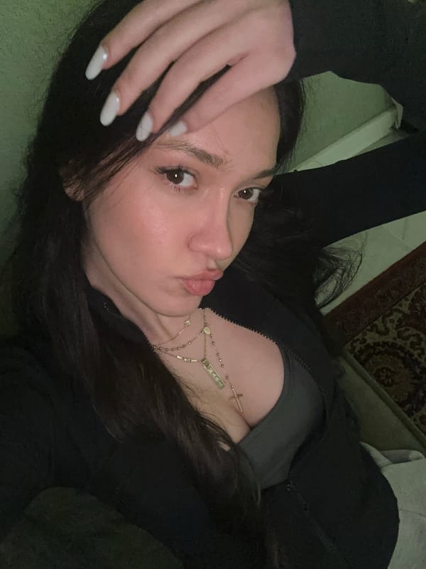 Women arrange pink rose bouquets in Yerevan indoor setting