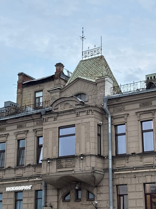 Evening along the Neva: landmarks, warships, and city streets