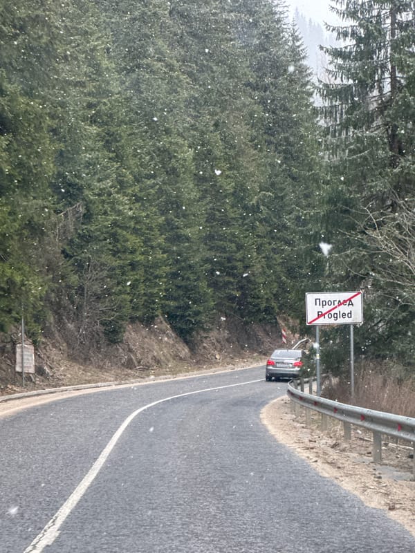 Light snow falls as driver travels through Progled, Bulgaria