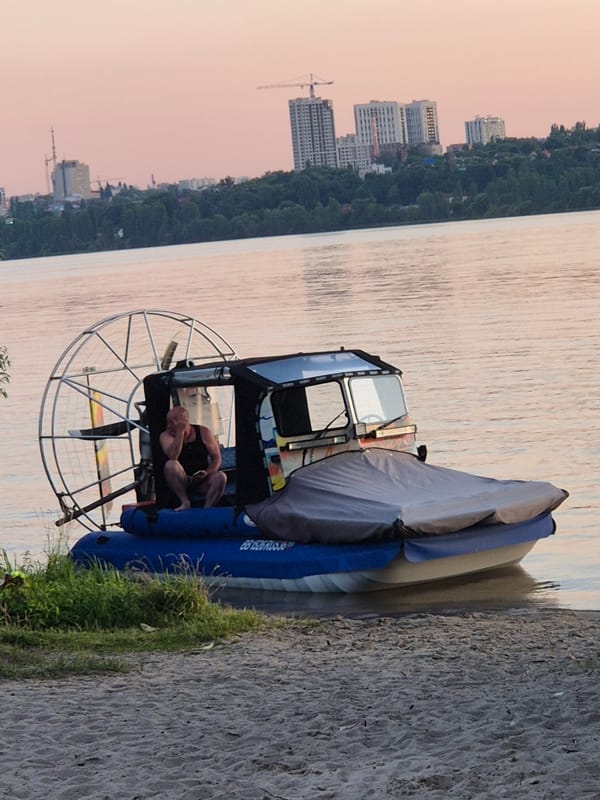 Beach hangout and active construction site at Voronezh sunset