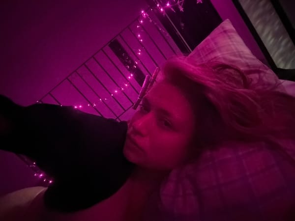 Colorful LED-lit portraits in a Nha Trang bedroom