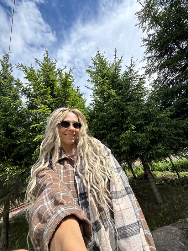 Woman takes selfie with child in Russian woods