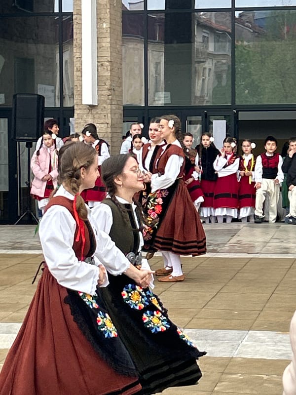 Folk dancers perform traditional Bulgarian dances outside Blagoevgrad opera house