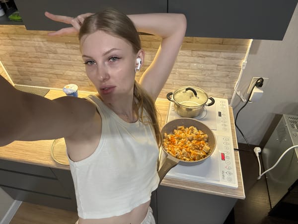 Woman cooks chicken dinner in Perm kitchen